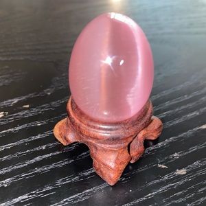 Cat’s eye egg crystal in pink, stand included